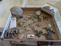 Overview of assorted jewelry items displayed in tray