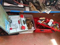 Wide view showing wooden mallets and the red plastic toolbox containing various tools and the Shelton set.