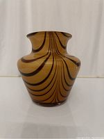 Front view of Murano amber striped glass vase showing pattern and shape