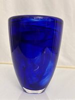Full front view of the vase showing its deep cobalt blue color and shape.