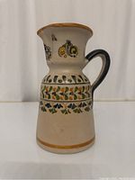 Full view of the Spanish Talavera-style pitcher showing its overall shape and painted decoration