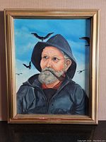 Frontal photo of the framed original fisherman painting showing the full artwork.