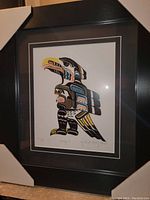 Overall view of the professionally framed print with protective corner covers to show size and framing style.