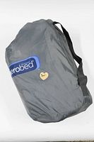 Closed grey AeroBed-branded carrying bag with handles, containing the inflatable mattress and pump.
