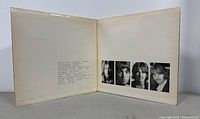 Inner gatefold of the White Album showing band portraits and track credits.