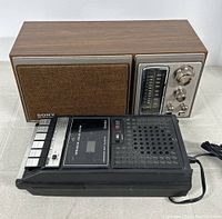 Sony Bass Reflex System AM/FM radio and Viking cassette tape recorder side by side on table.