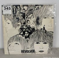 Front cover of The Beatles Revolver vinyl record album showing detailed sketch-style artwork and photo collage.