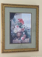 Full view of the framed floral print showing the entire artwork and ornate gilded frame.