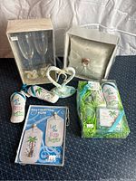 Full view of all wedding set items including champagne flutes, ring bearer pillow, cake topper, door decoration, luggage tags and bath set