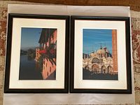 Two framed photos: one riverside scene with balcony and flowers, one St. Mark's Basilica in Venice