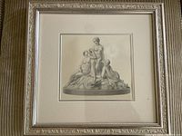 Framed print showing the entire etching with mat and frame, hung on a wall.