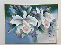 Front-facing image of the large painting focusing on the floral design of white orchids against a blue-green background.