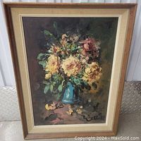 Front view of the framed original oil painting showing floral bouquet in blue vase, signed by artist.