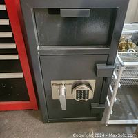 Full front view of the safe showing keypad and handle