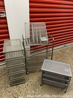 Full view of all metal mesh storage pieces including stacking drawers, cart, desk organizer, and two-drawer unit.