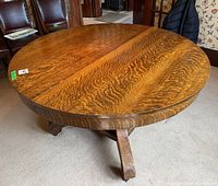 Wood round dining table top showing the wood grain and texture.