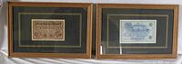 Two teak framed original German banknotes displayed side by side behind glass, matted with black and gold.