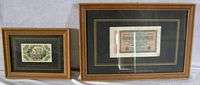 Two framed German banknotes side by side showing entire lot including teak frames and black matte with gold trim.