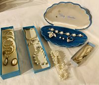 Overview of all boxes and clam shell showing entire jewelry assortment