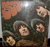 Front cover of The Beatles Rubber Soul album showing band members and album title on the vintage 1965 UK issue.