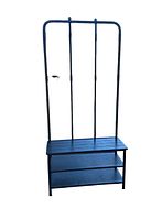 Front angled view of black metal coat rack with shoe shelves beneath and three vertical bars with hooks.