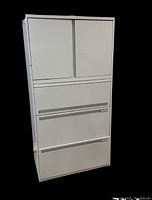 Front view of a light grey five-drawer steel filing cabinet with integrated handles for each drawer.
