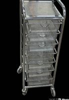 Front angled view of six drawer steel mesh organizer mounted on four caster wheels, showing mesh drawers and steel frame.