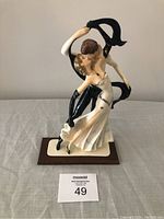 Front view of A. Santini ceramic Lovers Dancing figurine showing the couple mid-dance, highlighting details of dress and posture.