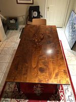 Top-down view of the full tabletop showing tiger maple grain pattern and finish