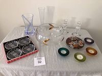 Overview of entire lot showing vases, dishes, candle holders, and 3-footed bowl