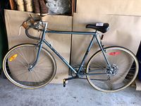 Side view of VeloSport Courrier 12 bicycle showing frame, wheels, saddle, pedals, and handlebar setup