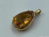 Front view of pendant showing citrine and bail