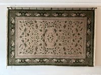 Full view of hanging rug showing overall design, colors, and size