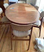 Full view of oval table with six chairs