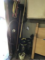 Image showing Stanley wet/dry vacuum, fireplace tools, hoses, mop/broom, bucket with fittings