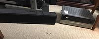 Yamaha YSP-800 sound bar and Harmon Kardon AVR146 receiver on carpet floor.
