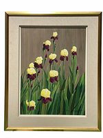 Framed oil painting of yellow and purple irises on green leaves with brown background.