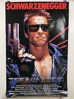 Front view of full poster displaying Arnold Schwarzenegger as The Terminator with production credits.
