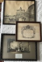 Overall view of three framed antique wall hangings including Cliff House photo, 1875 marriage certificate, and 1912 Lulu Temple play photo with entrance card.