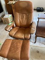 Full view of recliner chair and ottoman on floor