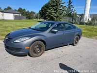 Gray 2009 Mazda 6 side view showing overall exterior and winter tires on rims
