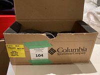 Columbia Sportswear Company cardboard box with arrangement of multiple black circuit breakers inside