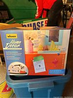 Photo of boxed Wagner Home Decor paint sprayer showing product features and condition