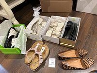 Overview of five pairs of women's casual shoes including various styles and colors placed together.