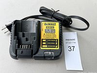 Front view of the DeWalt DCB112 battery charger showing overall condition and cord bundled.