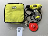 Ryobi drill set with carrying case and accessories arranged on table