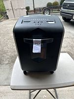 Front view of a black Bonsai paper shredder showing the control panel and paper feed slot.