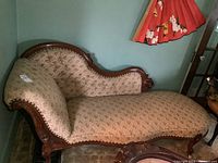 Front view of entire chaise lounge showing overall shape and condition