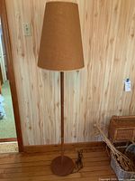 Full view of lamp showing base, stem, shade, power cord and switch