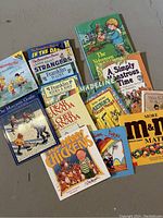Photo showing 15 assorted children's books laid out to display covers and titles